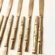 12 gold table knives, Hollywood Regency – circa 1970