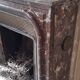 Louis XIV style fireplace in veined Carrara marble and 19th-century ceramics.