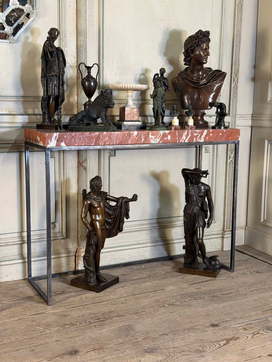 Pair of contemporary consoles in marble and metal.