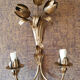 Gold sconces with floral decoration