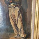 Old peasant painting in the hat
