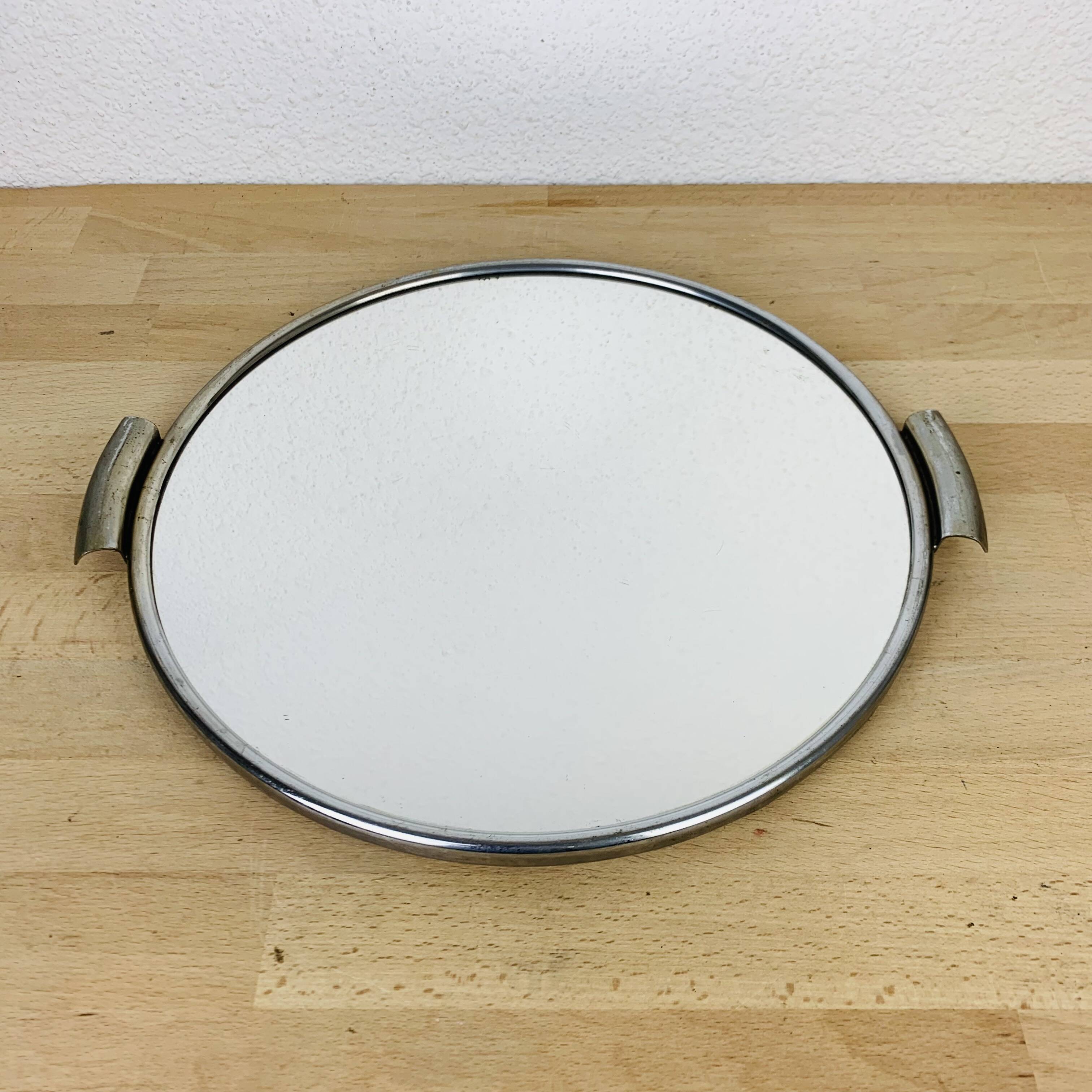 Round mirror plateau from the 1950s.
