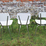 3 old white Formica chairs