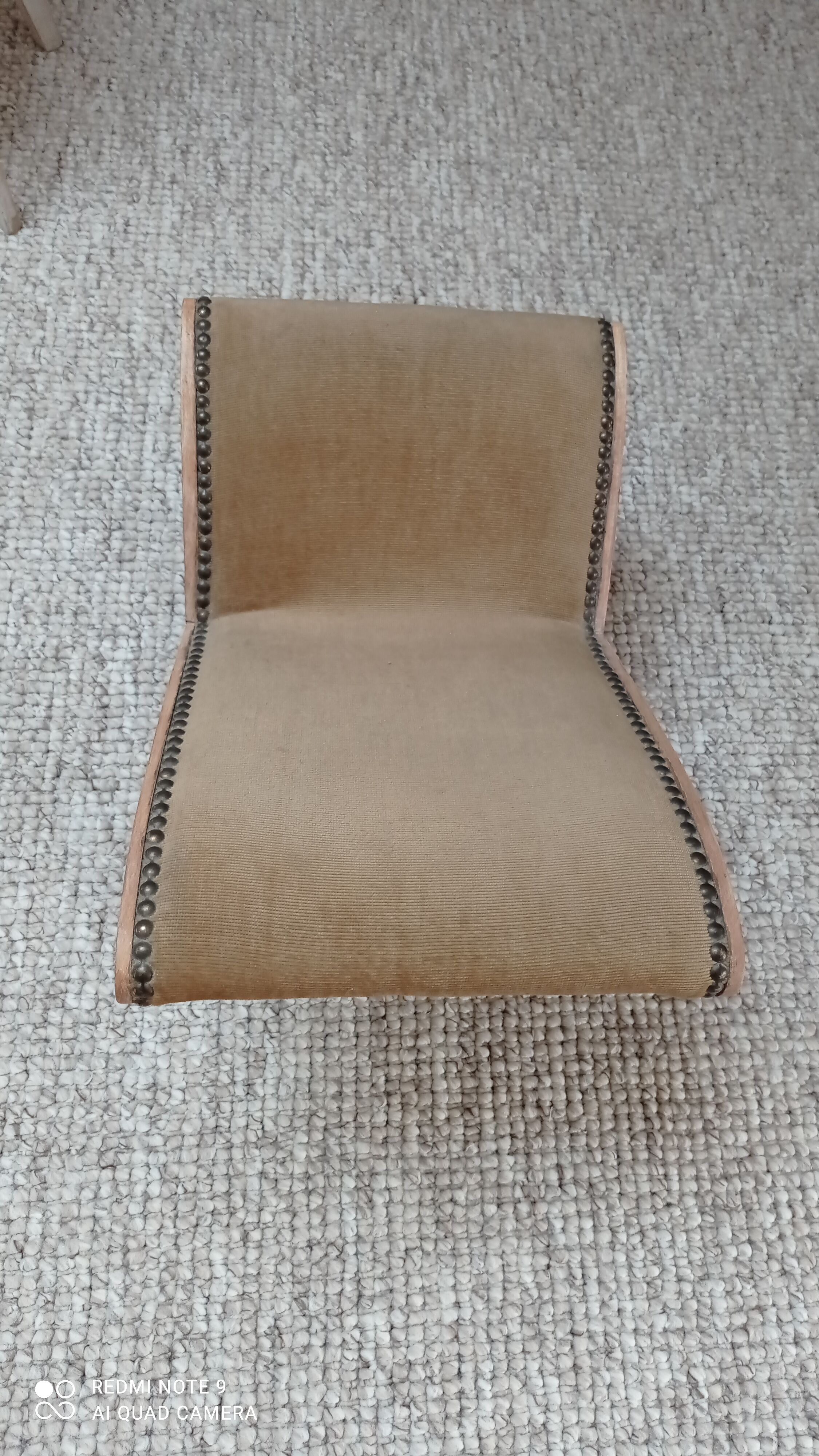 Footrest upholstered in wood