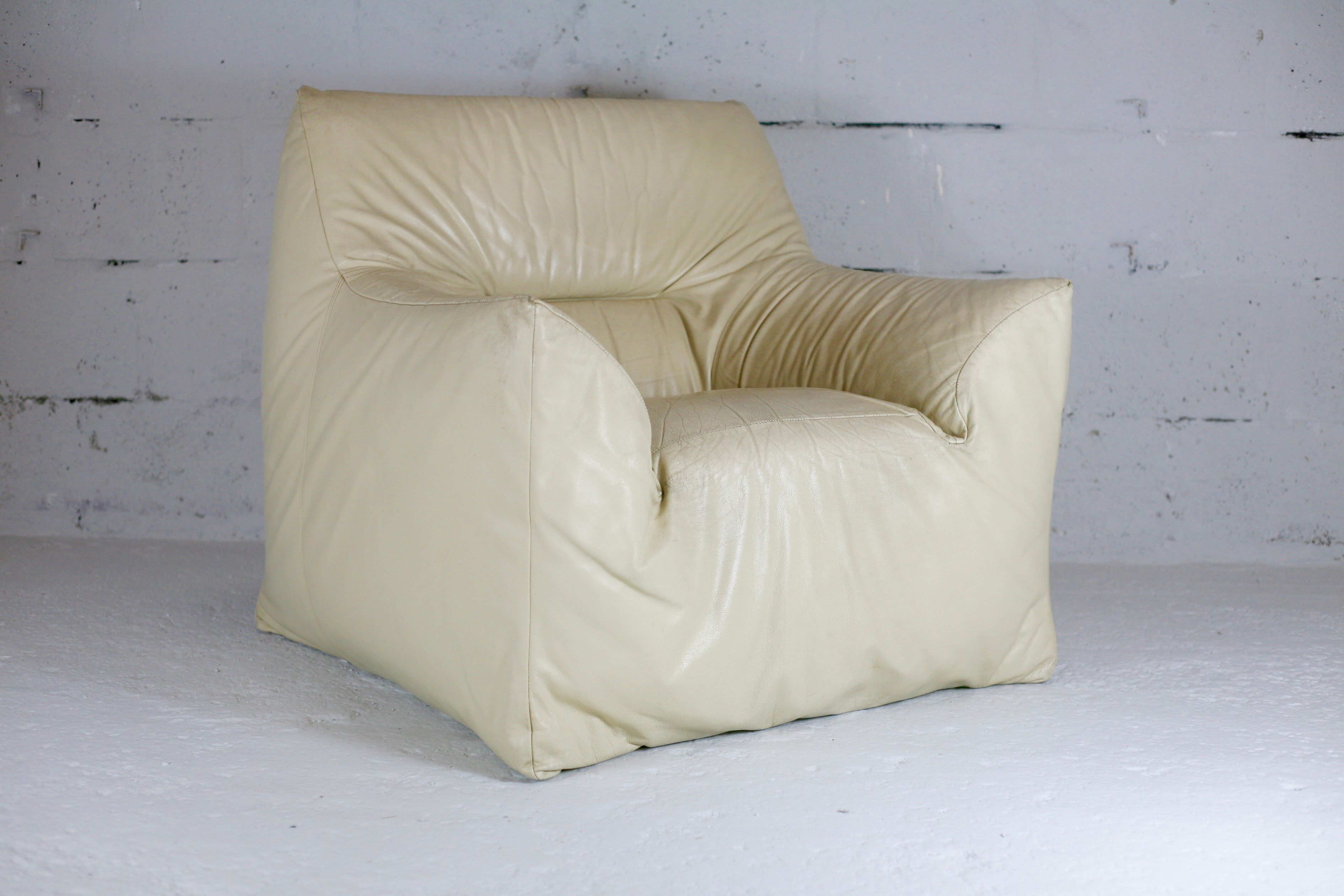 Leather armchair and cream-coloured foam, France , circa 1970