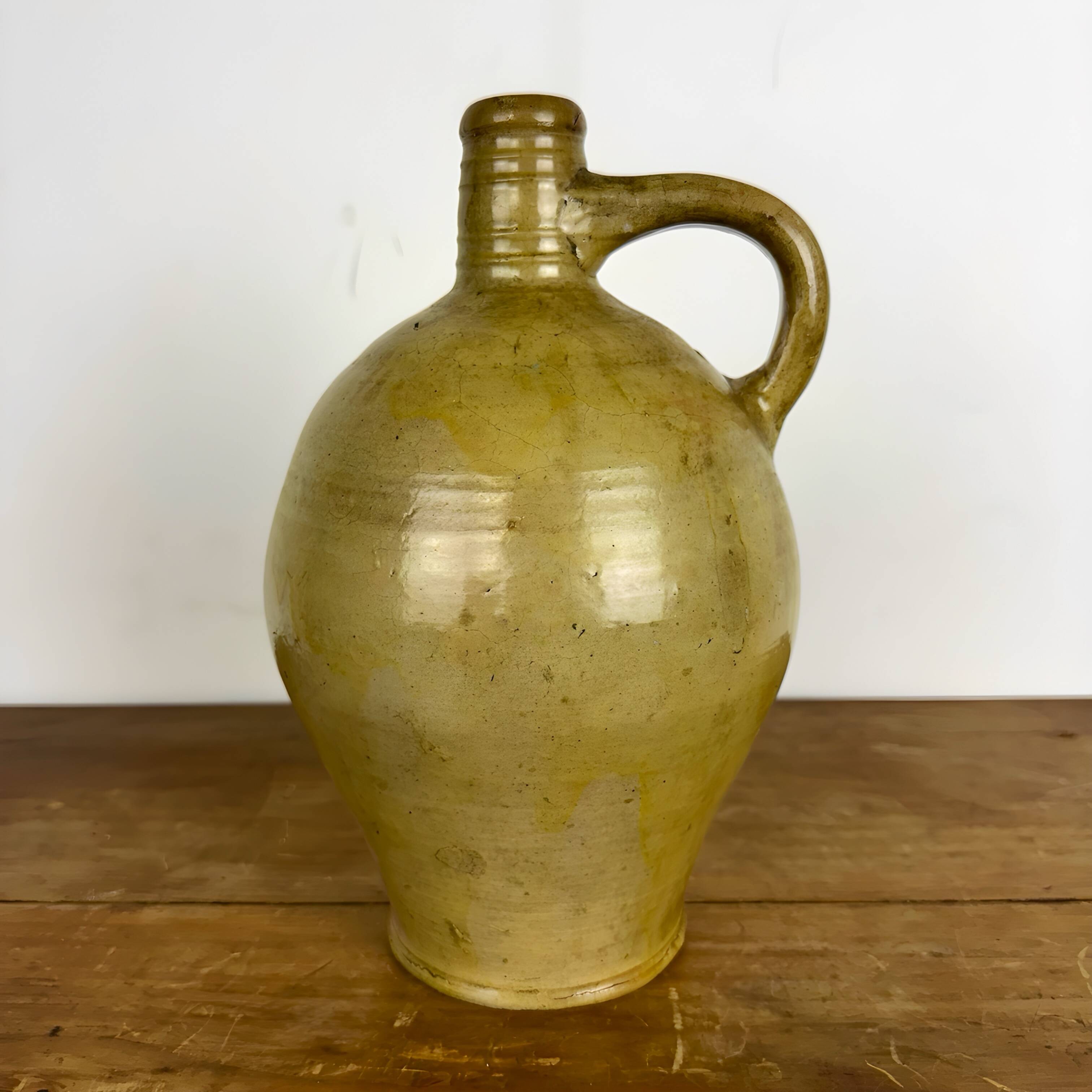 Antique glazed earthenware jug