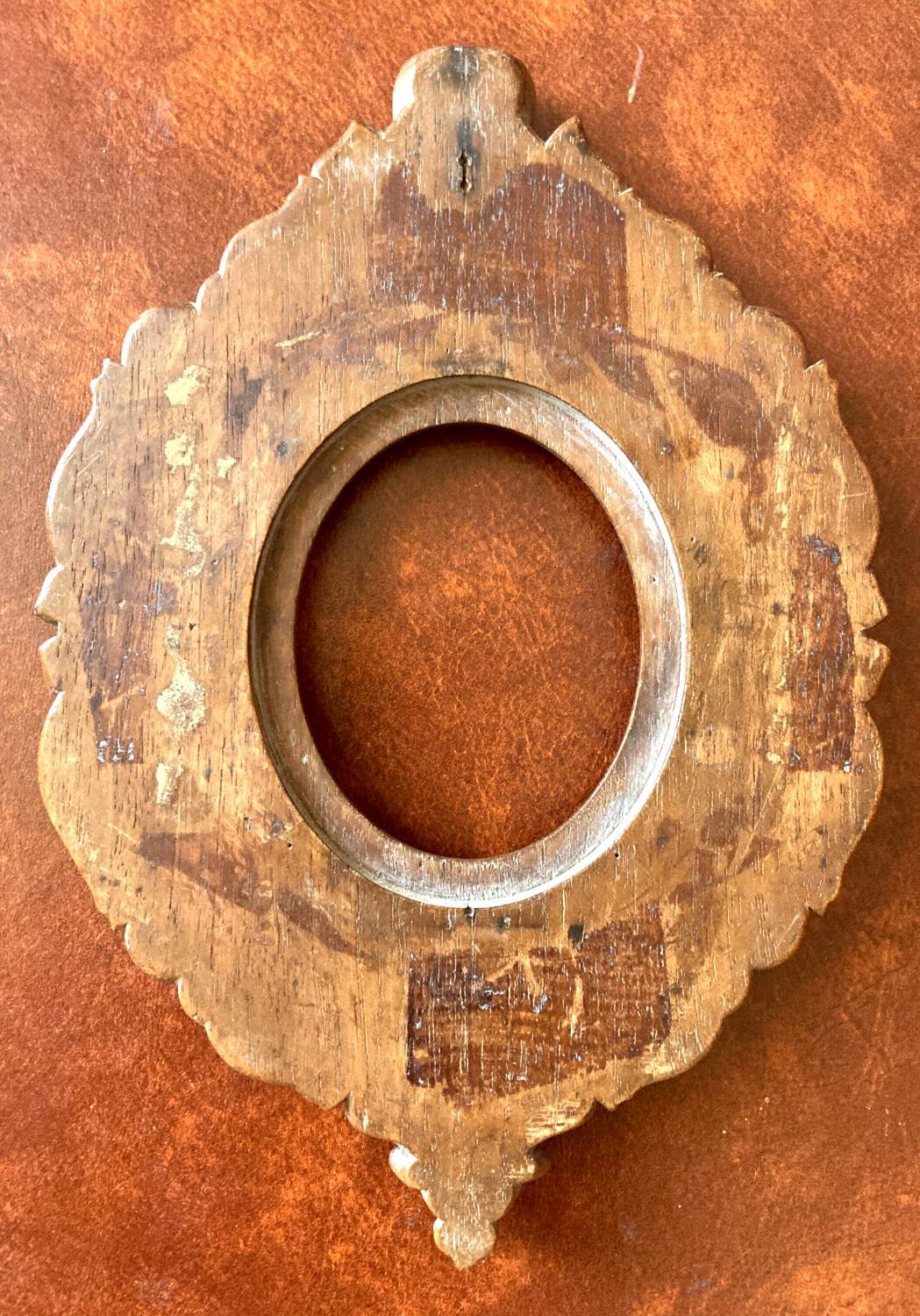 Carved oval wooden frame