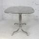 Chrome steel table with smoked glass top, France, circa 1970.