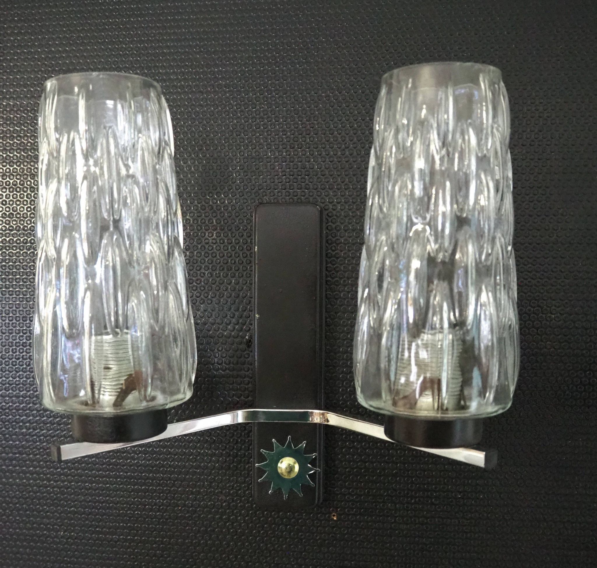 Pair of wall lights from the 1950s-1960s with a push button switch.