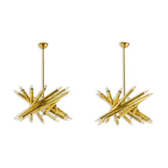 Pair of 24-light patinated brass chandeliers. 1980s.