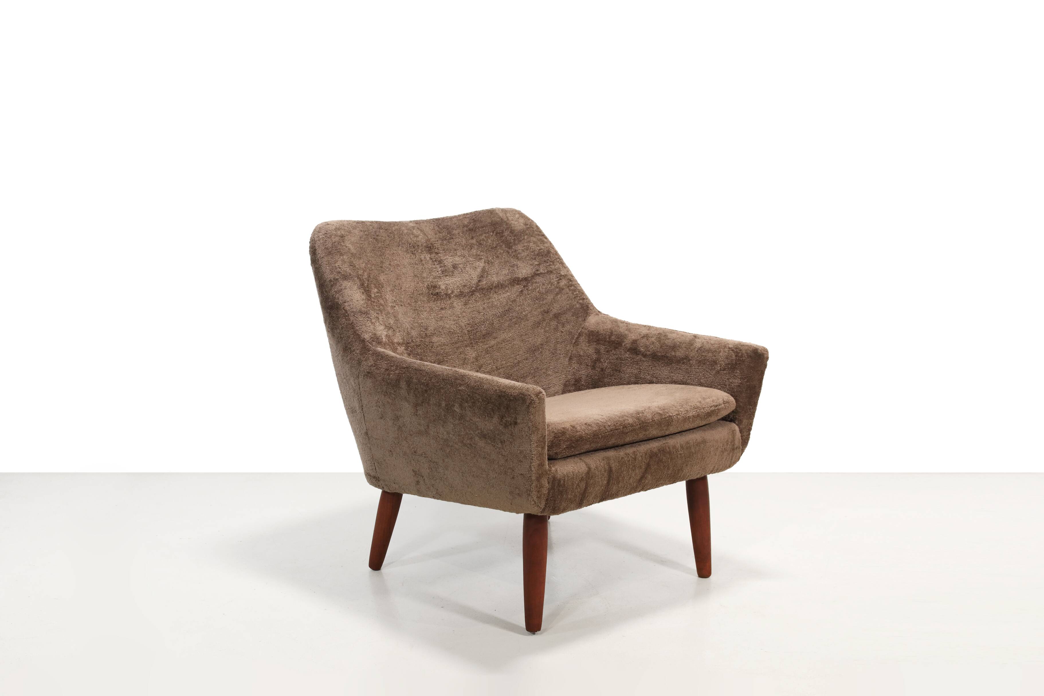 Danish design armchair in brown faux sheepskin