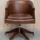 Vintage Patinated Leather Chesterfield Swivel Captain's Armchair
