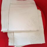 2 pillowcases with handmade lettering and day surround.