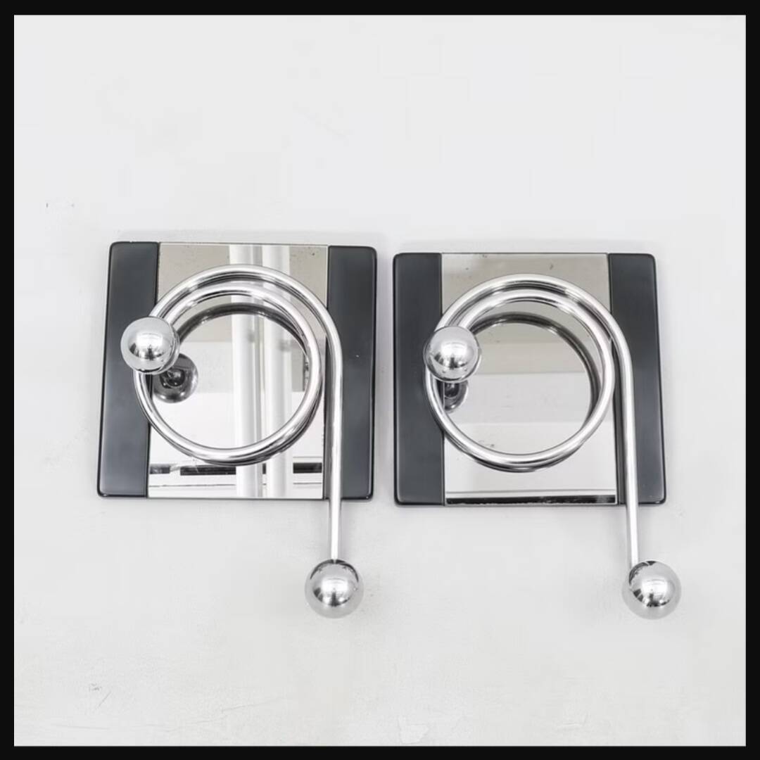 2 mirror hooks designed by Mario Sabot in Italy in the 1970s.