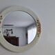 Vintage round mirror Syla model 6131 with rose decoration.