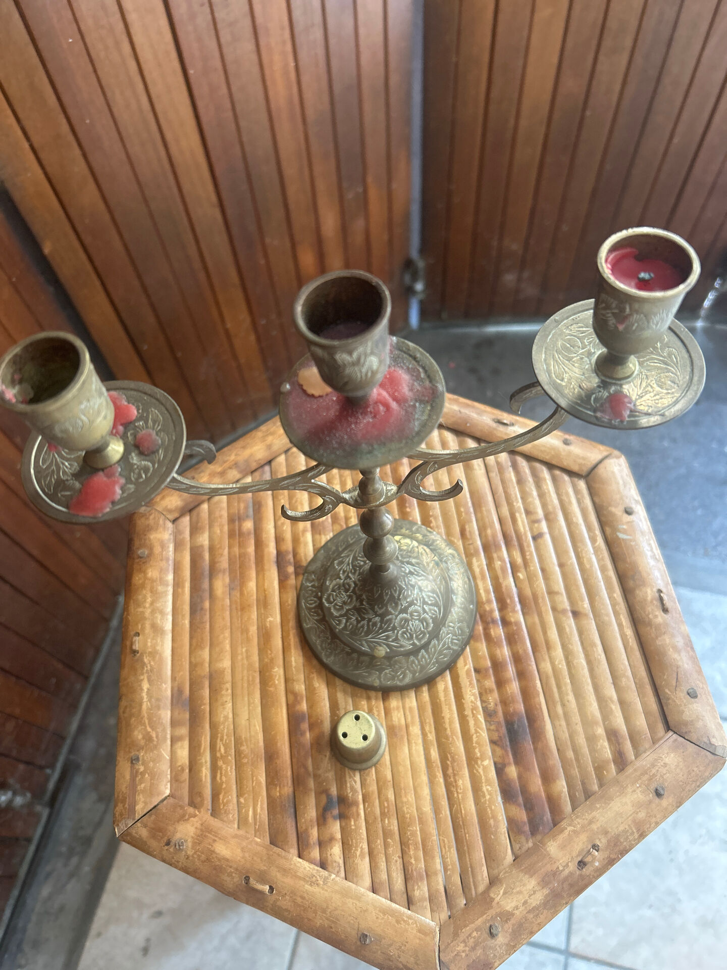 Vintage brass candelabrum engraved with three lights and a snuffer.