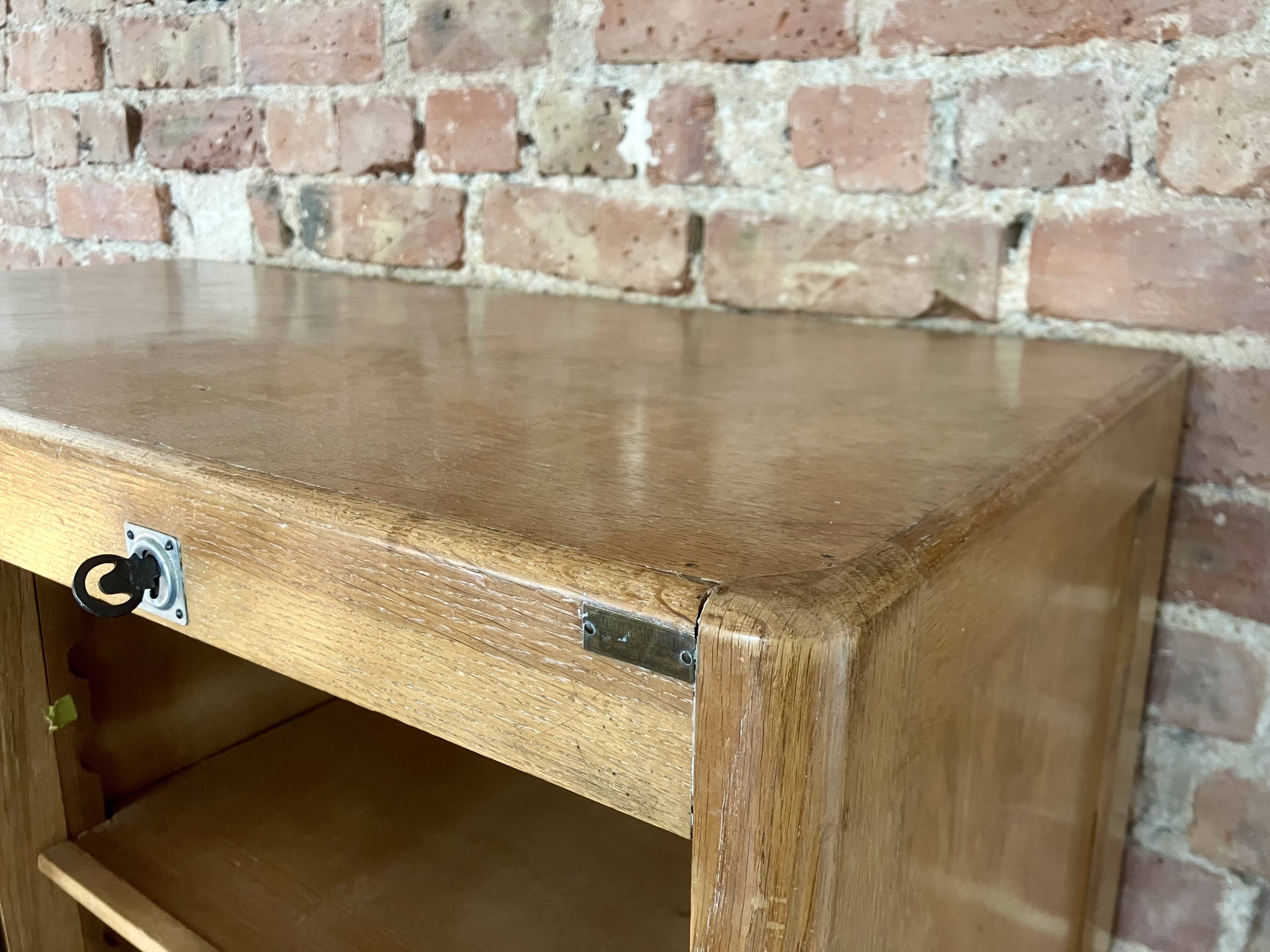 Double curtain filing cabinet in oak — on legs
