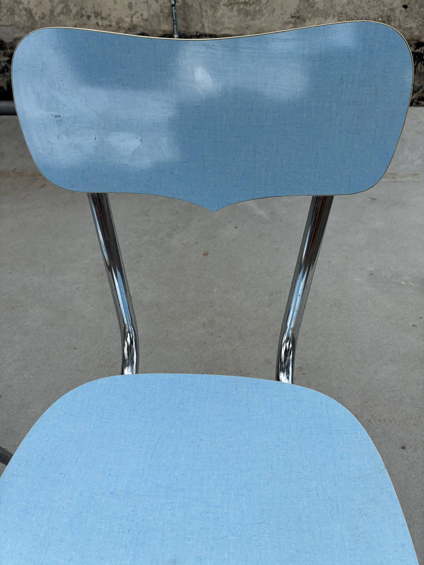 Two blue Formica "Peugeot" chairs.