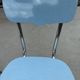 Two blue Formica "Peugeot" chairs.