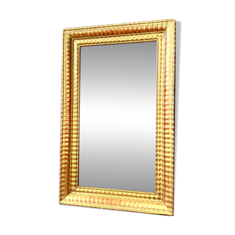 Antique gilded mirror from the Directoire period, 19th century.