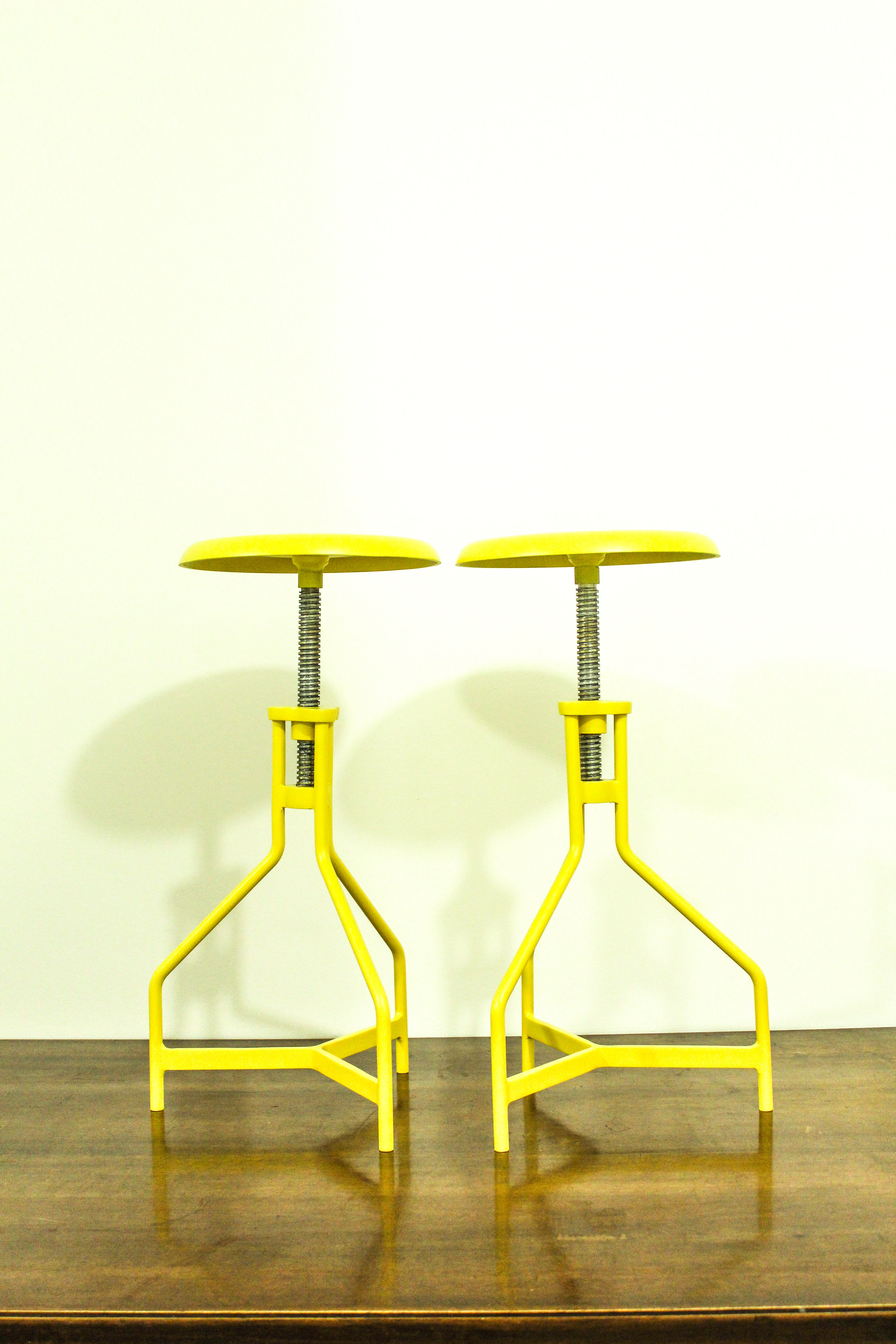 Pair of yellow lacquered metal stools, Restaurati, Italy 70's
