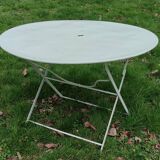 Old round folding metal table