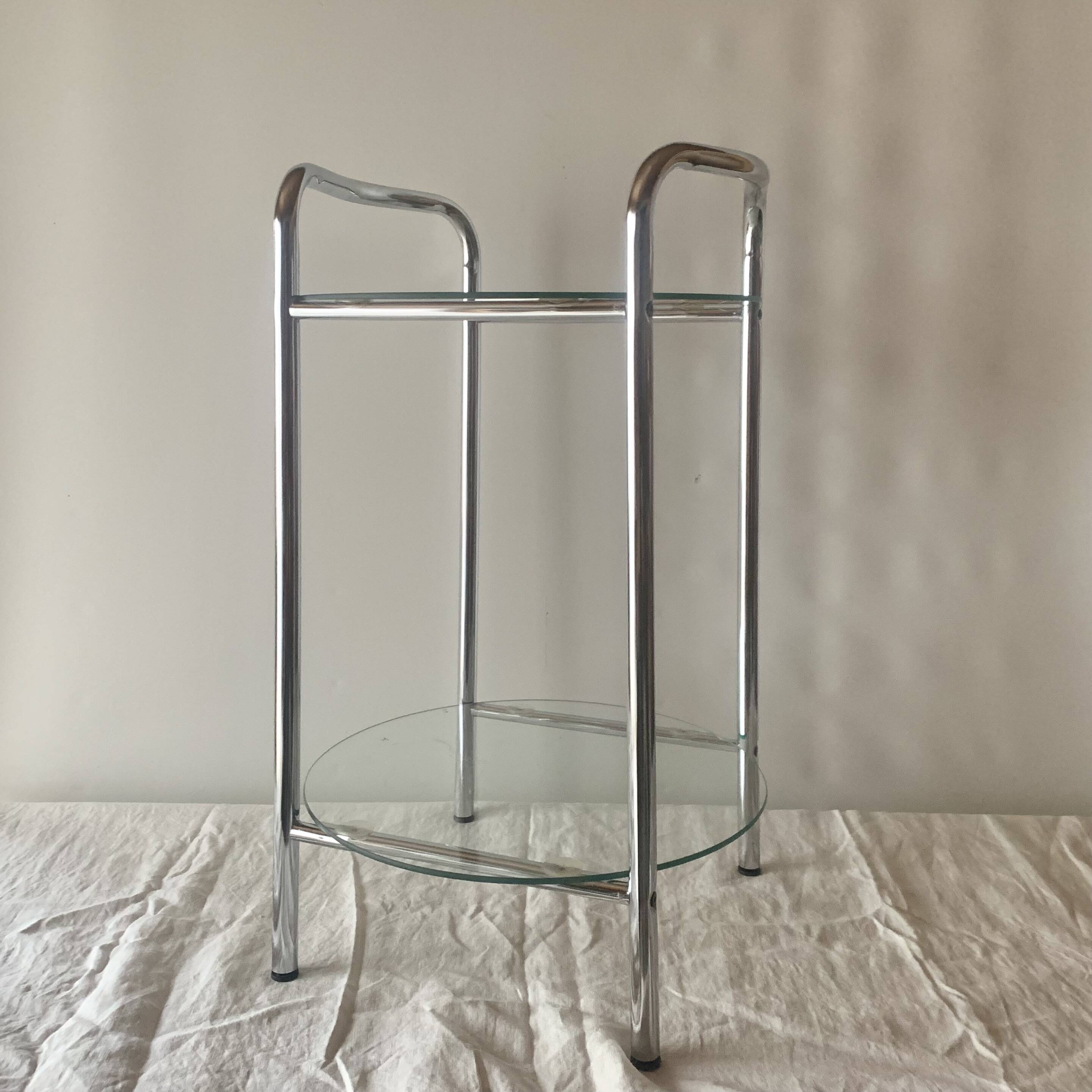 Pedestal table, vintage chrome steel saddle with 2 round windows