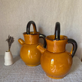 Enameled jugs signed Gomares