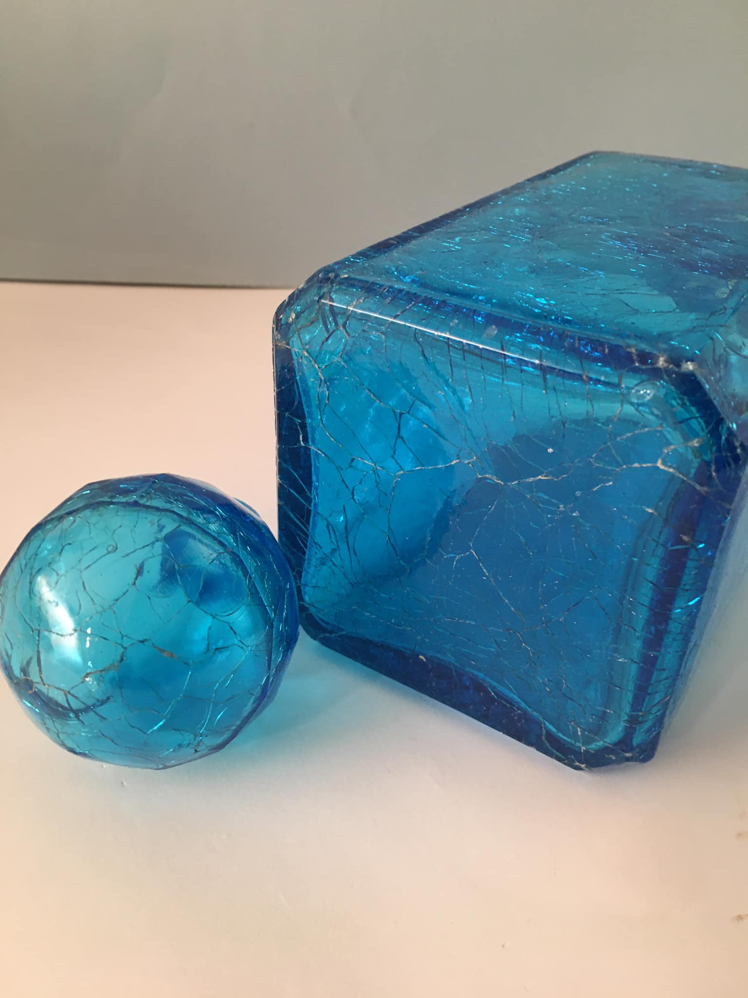 Blue glass bottle with glass cap