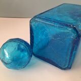 Blue glass bottle with glass cap