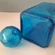 Blue glass bottle with glass cap