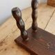 Vintage rectangular stool in dark wood with turned legs.