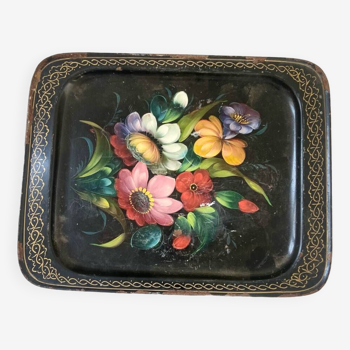 Old metal tray with flower pattern