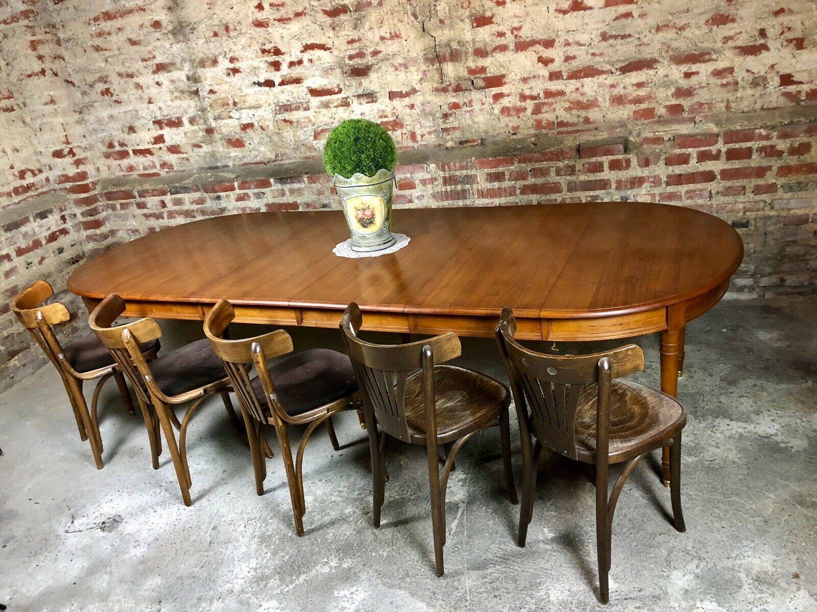 Oval walnut table with 6 legs from 1m12 to 2.94 (4 extensions of 45.5 cm)