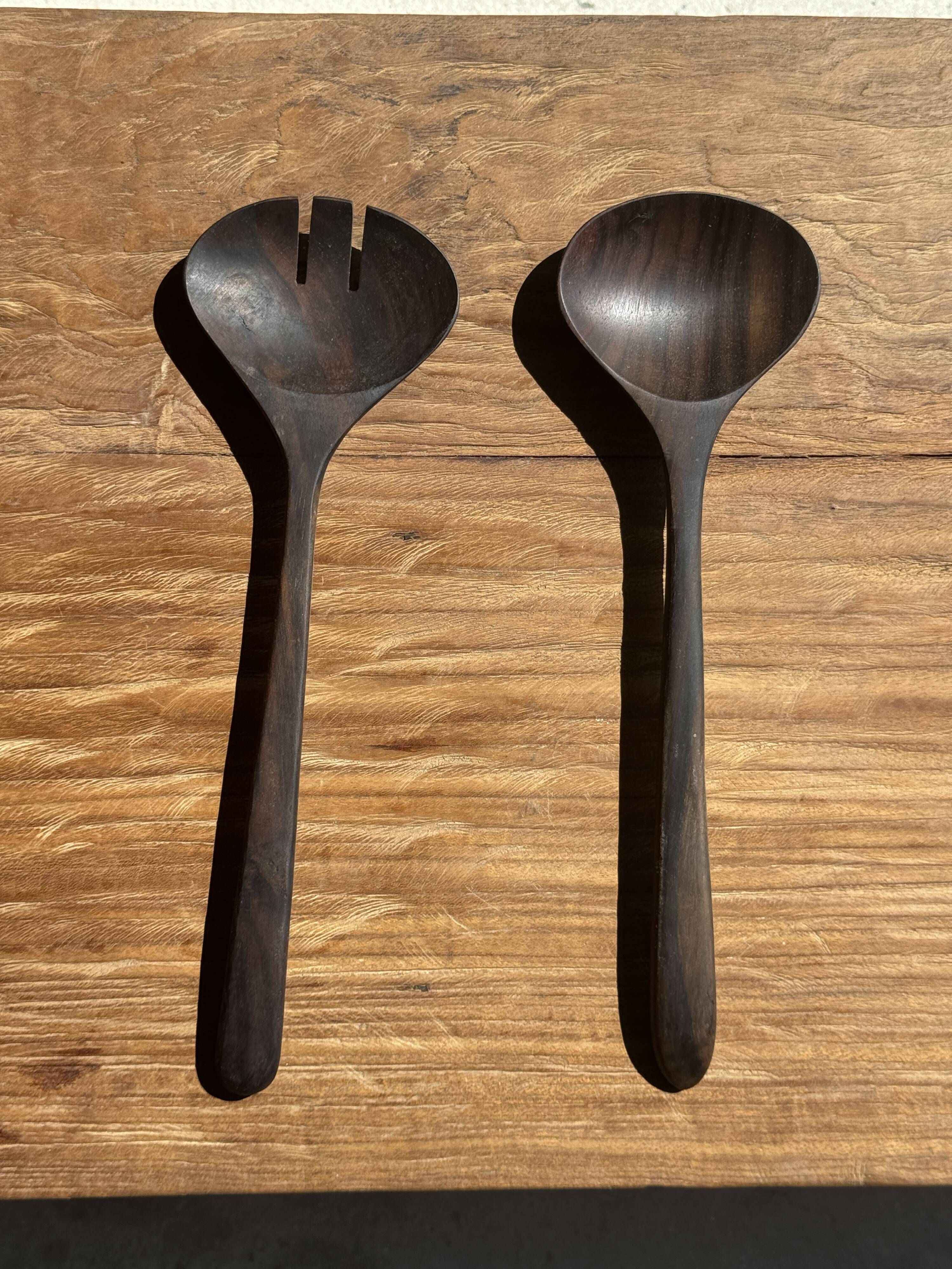 Pair of salad servers or kitchen utensils in blackened teak L30 D9