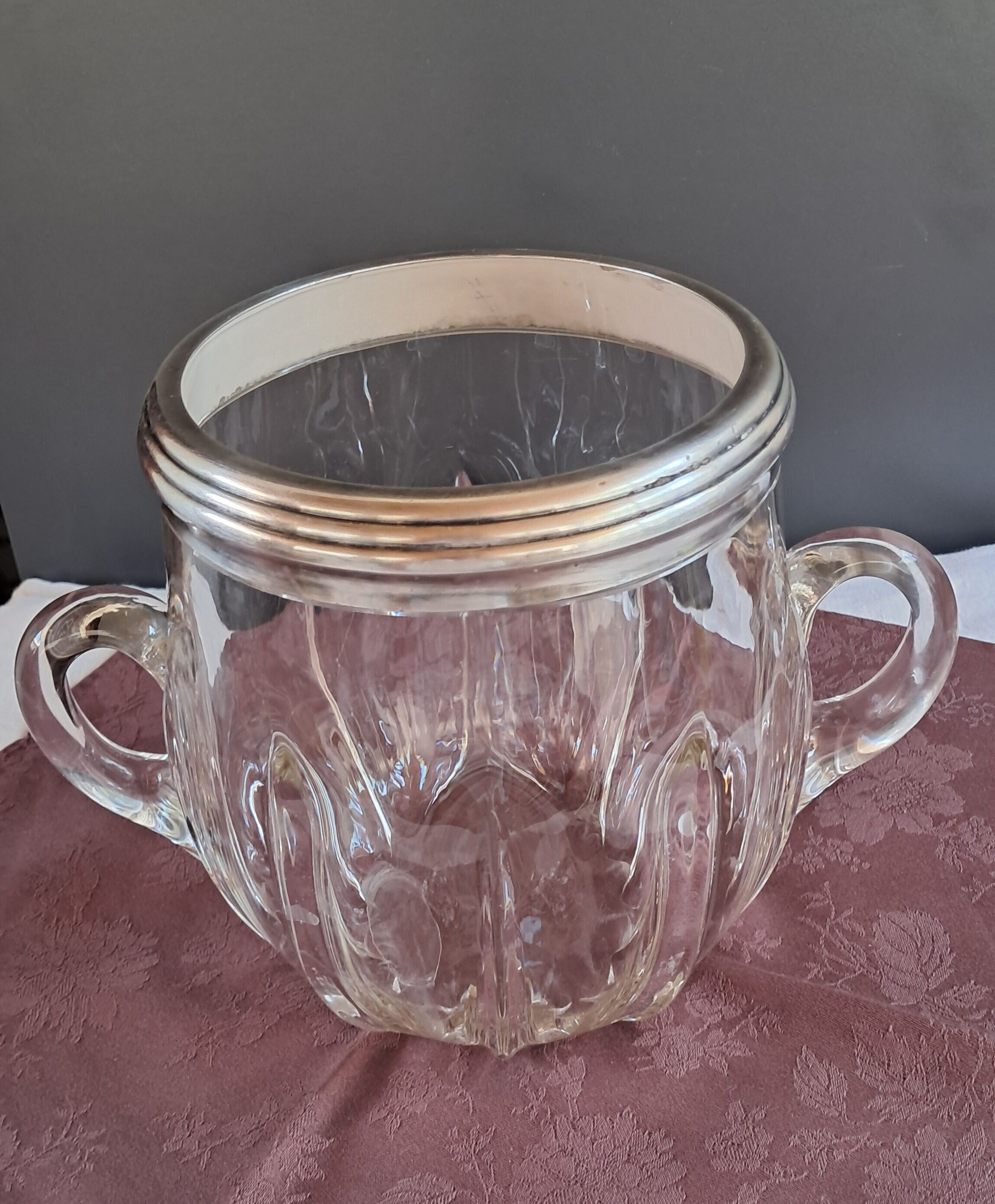 Twisted moulded glass bistro champagne bucket with a silver metal collar.