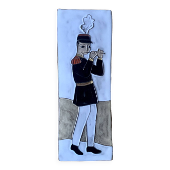 Small vintage enameled ceramic wall plaque - military flautist