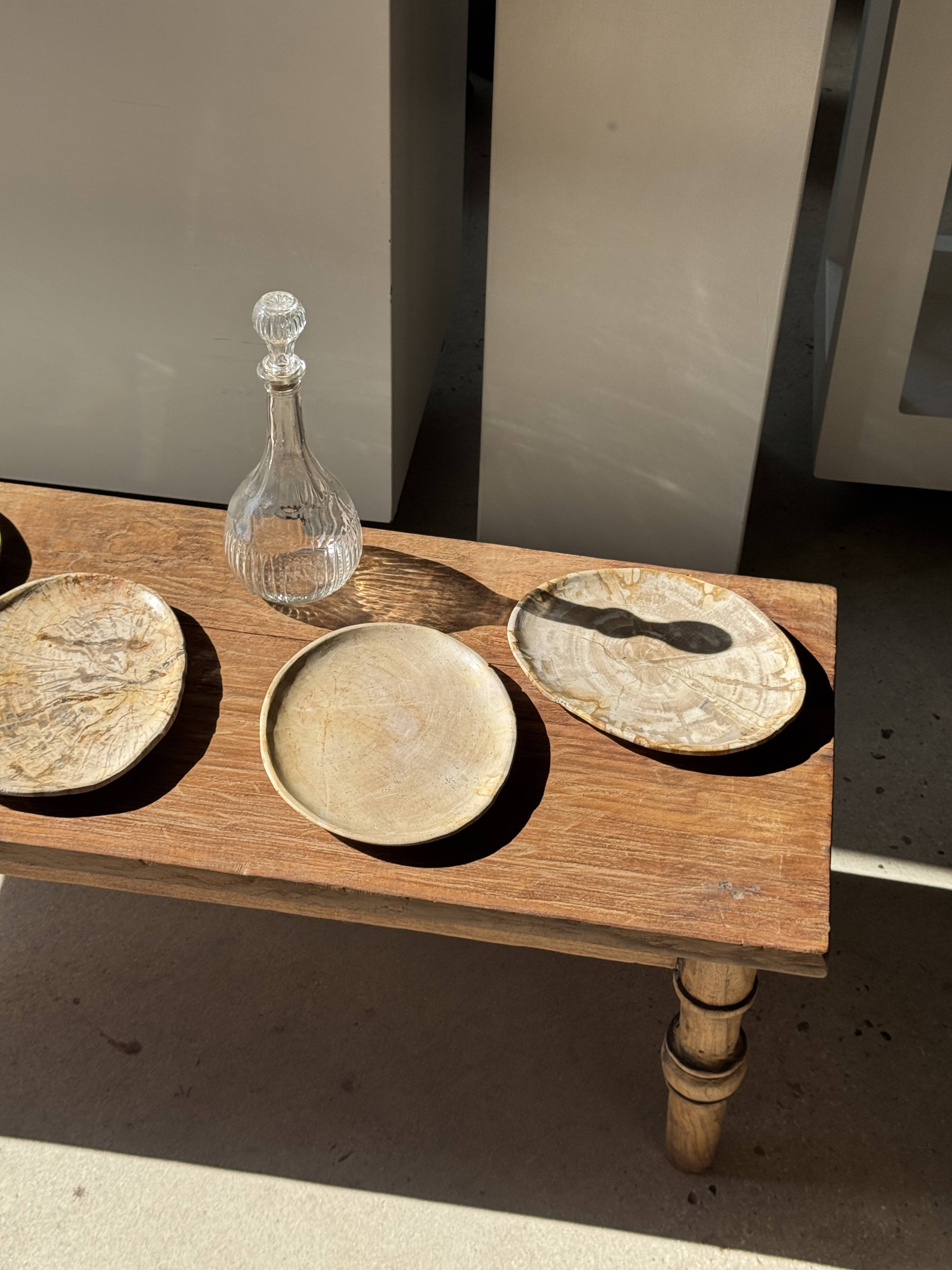 Small beige oval petrified wood dish or tray with crystals.