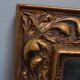wall mirror in a decorative wooden frame.