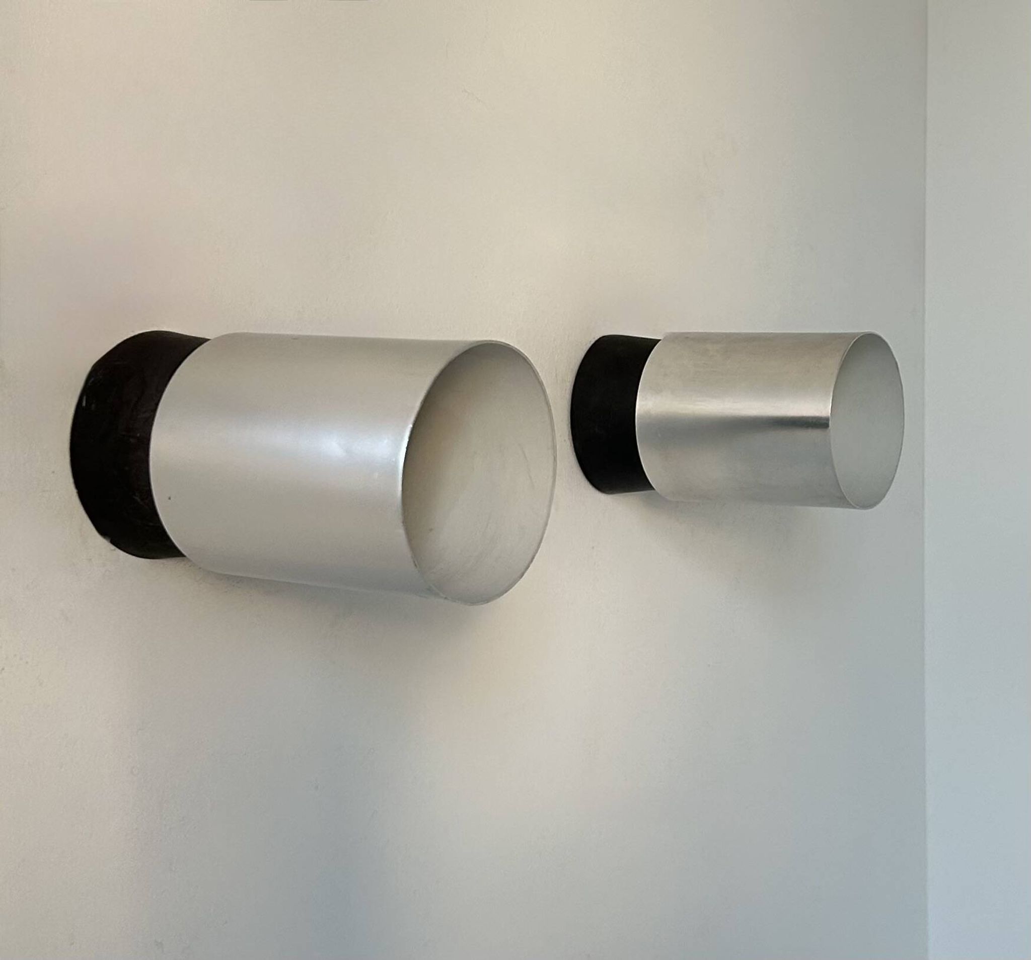 Pair of vintage wall lights, chrome-plated metal and Bakelite, France 1960.