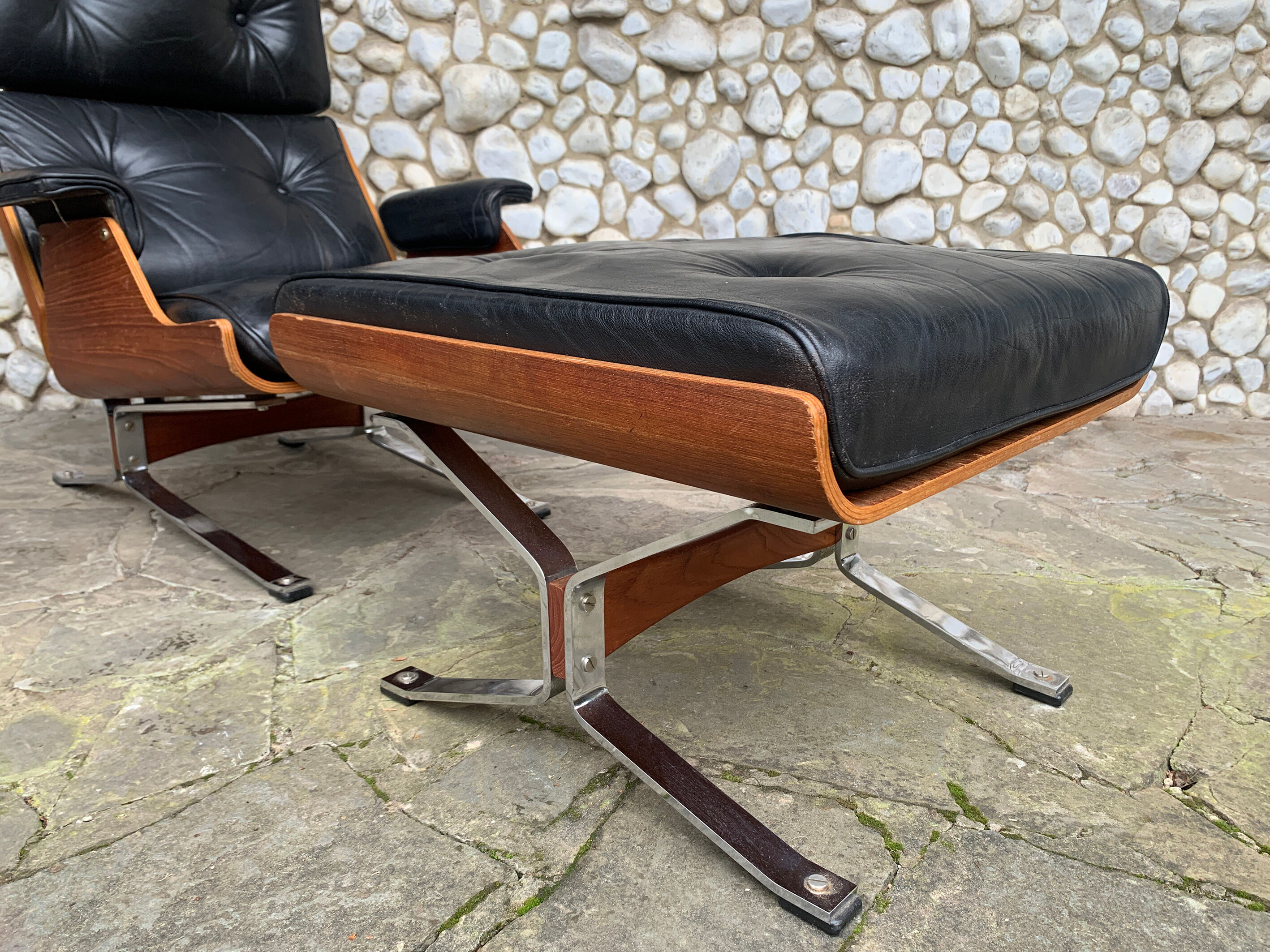 Lounge chair and ottoman black leather and teak multiplex, 1960