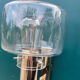 Wall lamp in stainless steel and globe in transparent glass