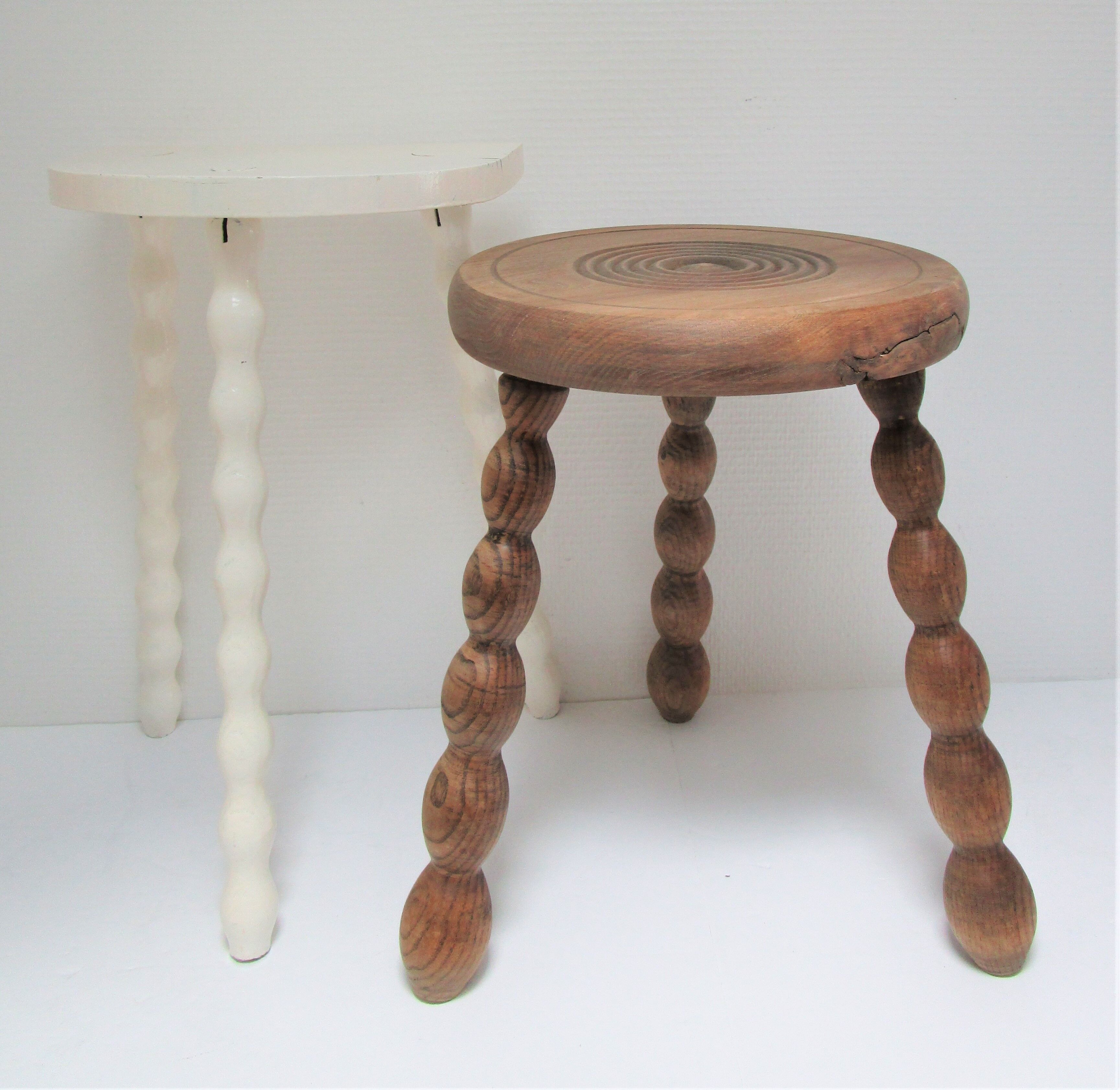 Two vintage tripod solid wood stools