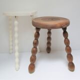 Two vintage tripod solid wood stools