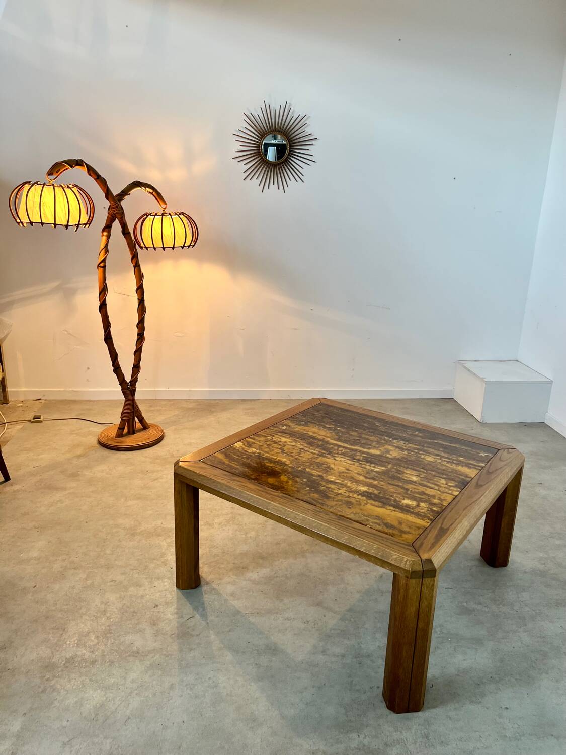 Old coffee table with golden marble top, 70s design, vintage wooden feet