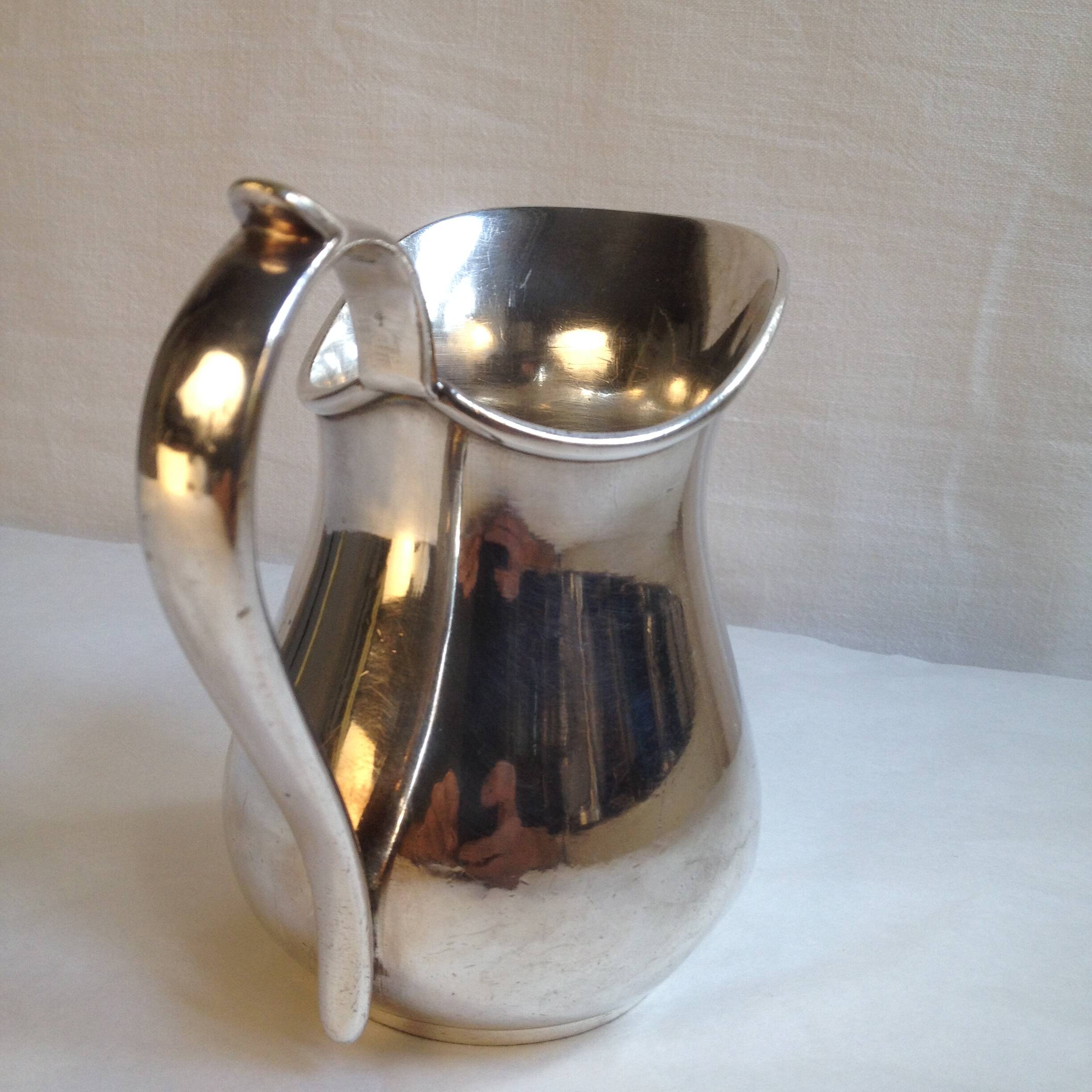 Silver metal milk jug