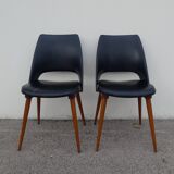 2 chaises en skaï noir pieds compas Louis Paolozzi