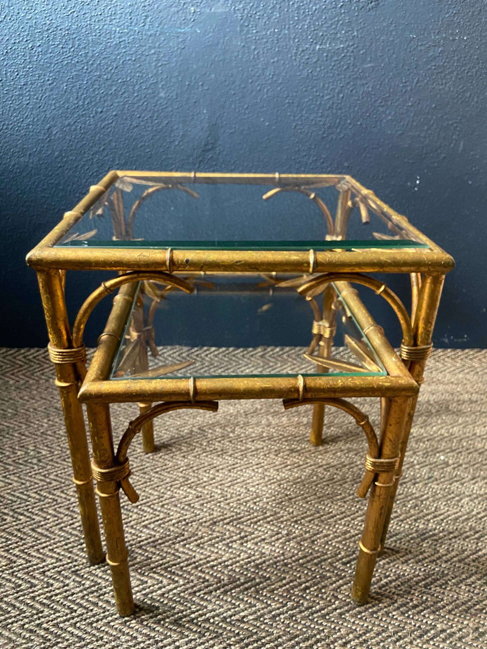 Pair of nesting tables in faux bamboo with glass tops, France, 1960s.