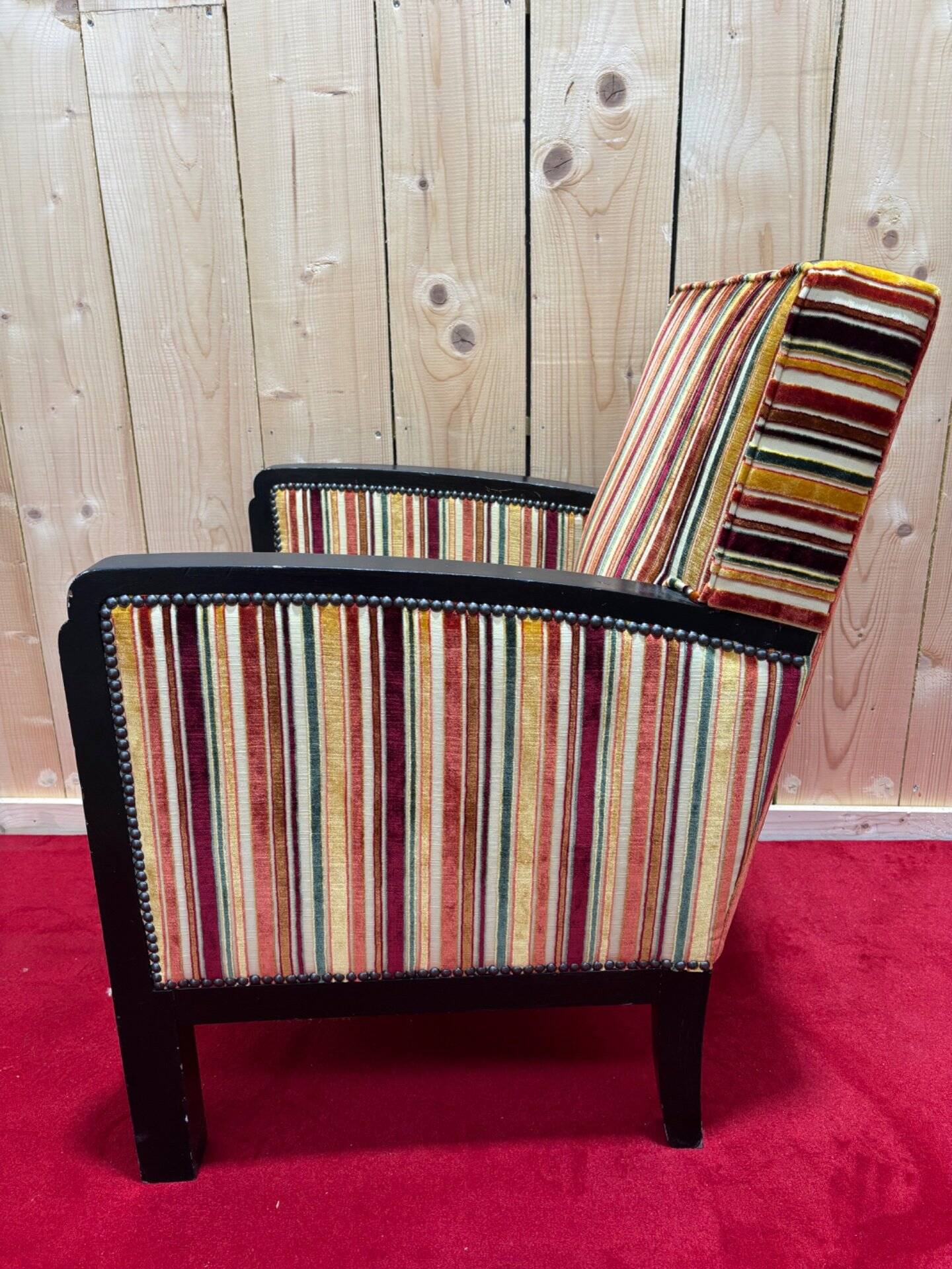 Art Deco armchair in multicolored striped fabric and its footrest