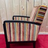 Art Deco armchair in multicolored striped fabric and its footrest